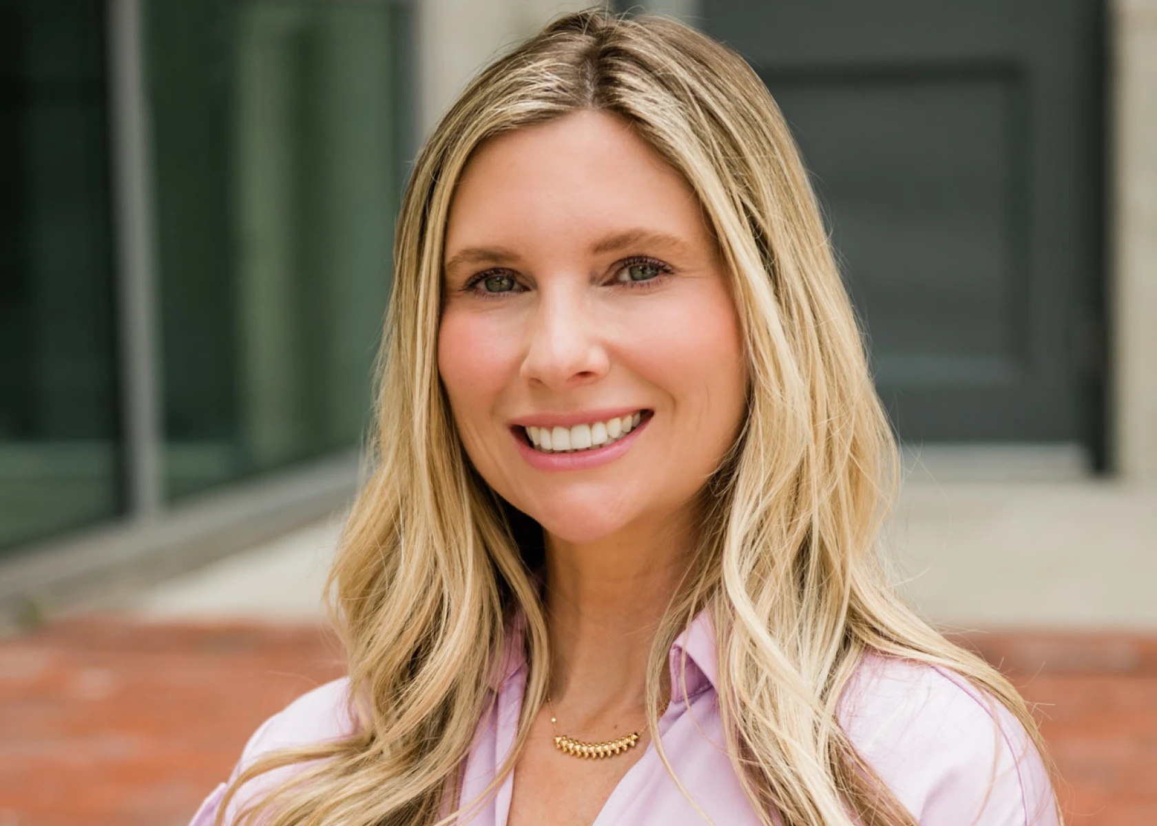 Woman in pink shirt outdoors